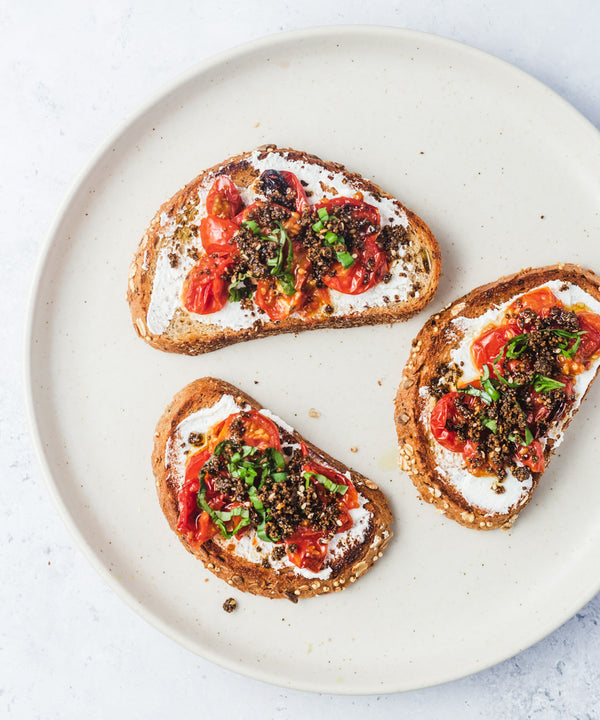 Roasted cherry tomatoes with ricotta on toast